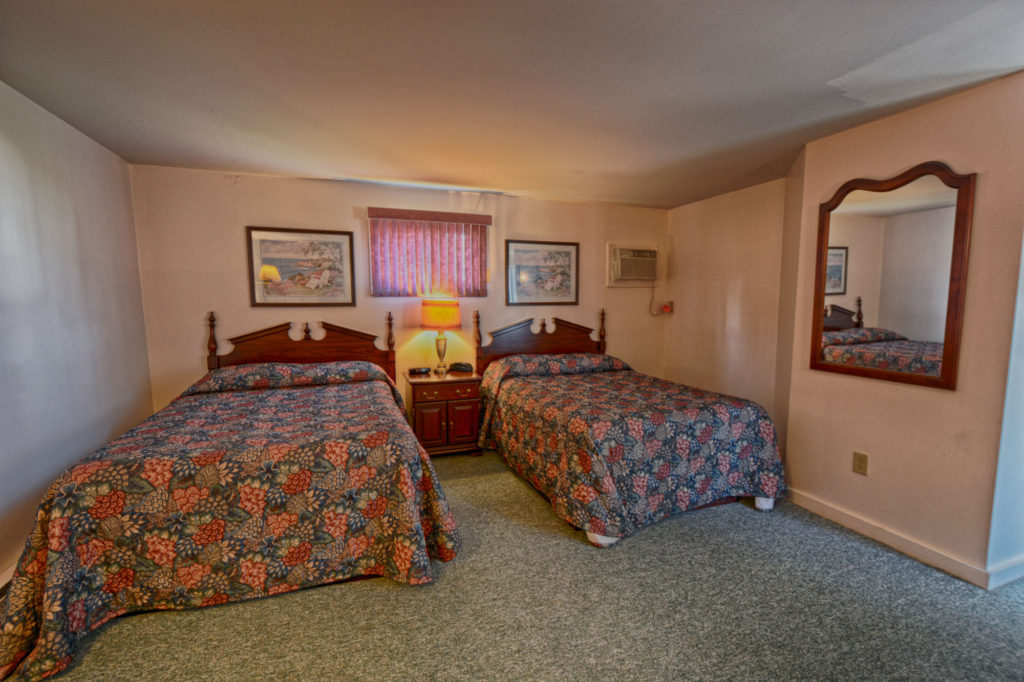 motel with two beds and sofa sleeper